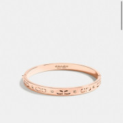 Coach kissing c hinged bangle